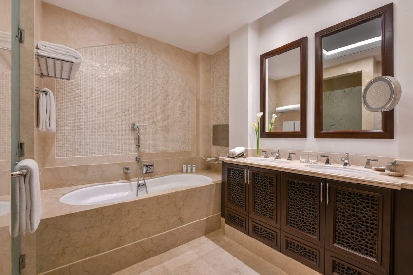 The St. Regis Doha Hotel - Doha, Qatar - Astor Guest Bathroom Vanity and Tub