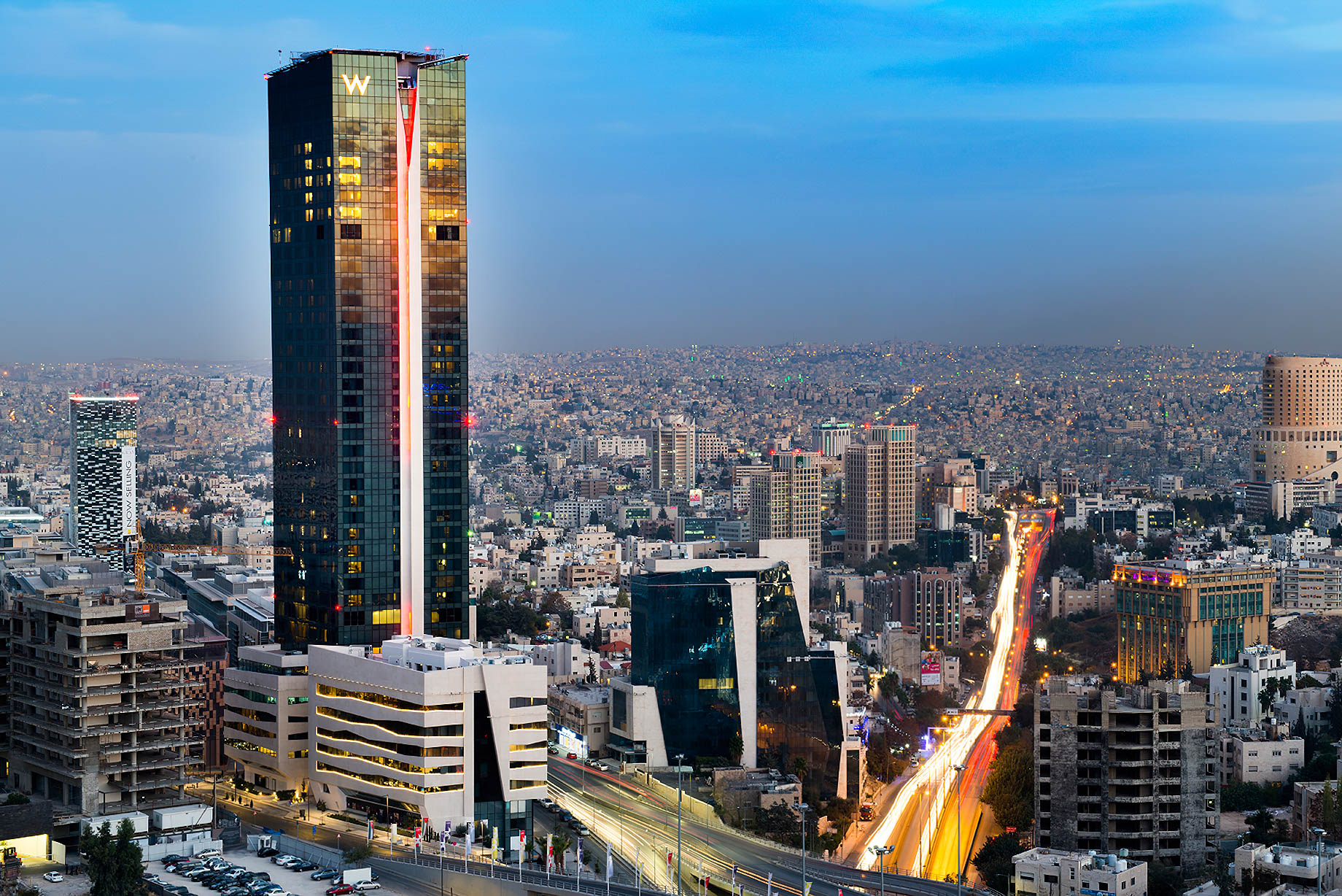 W Amman Hotel - Amman, Jordan - Hotel Tower Exterior Sunset