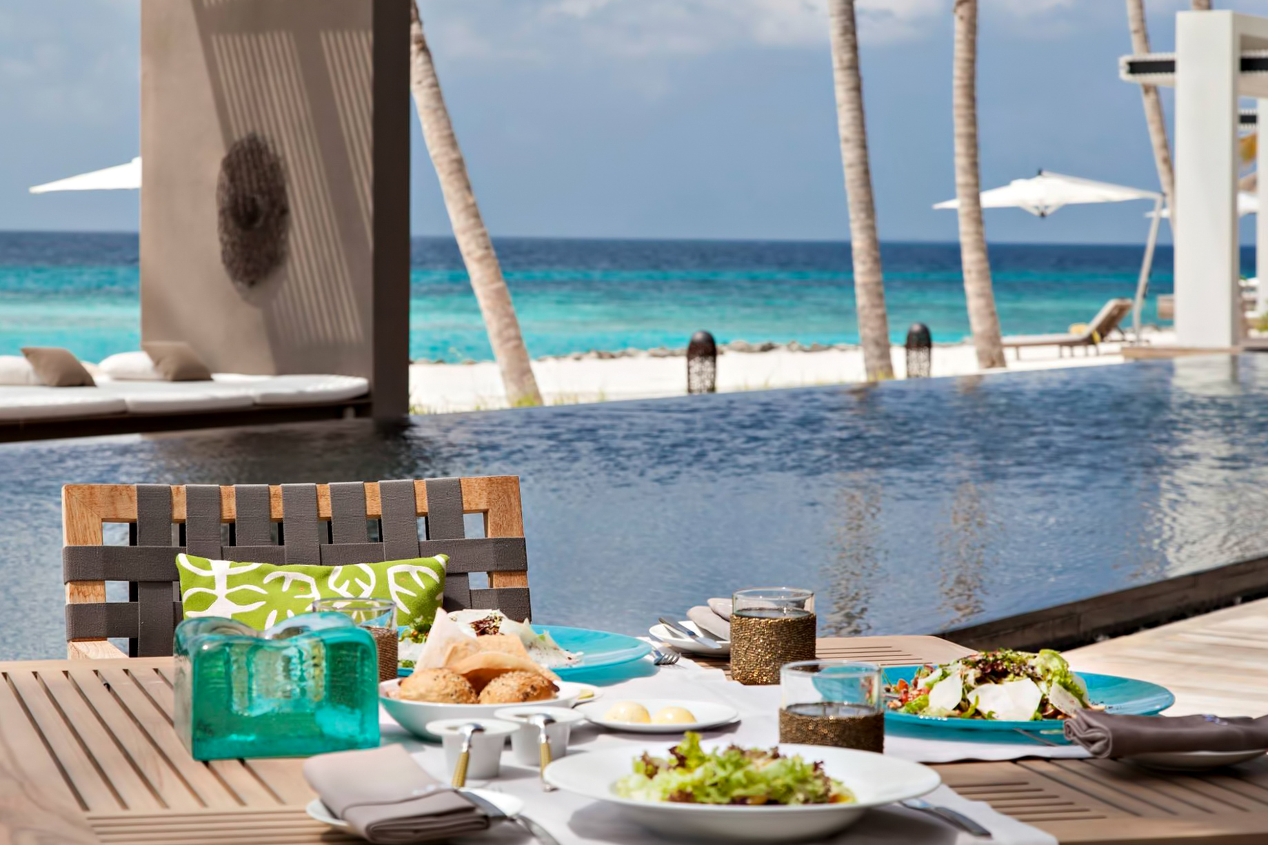 Cheval Blanc Randheli Resort – Noonu Atoll, Maldives – Infinity Pool Deck Dining Table