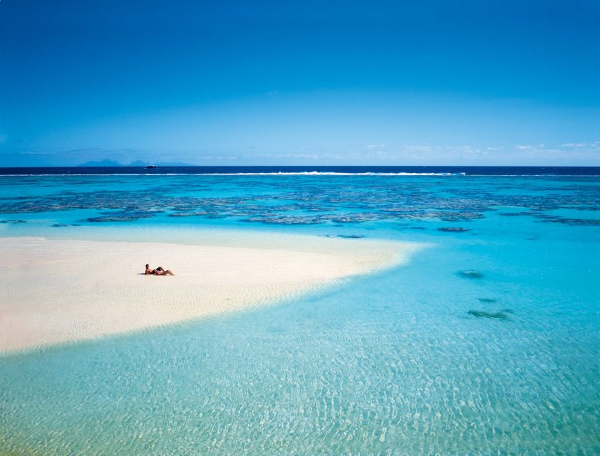 The Brando Resort - Tetiaroa Private Island, French Polynesia - Couple Lying on Beach