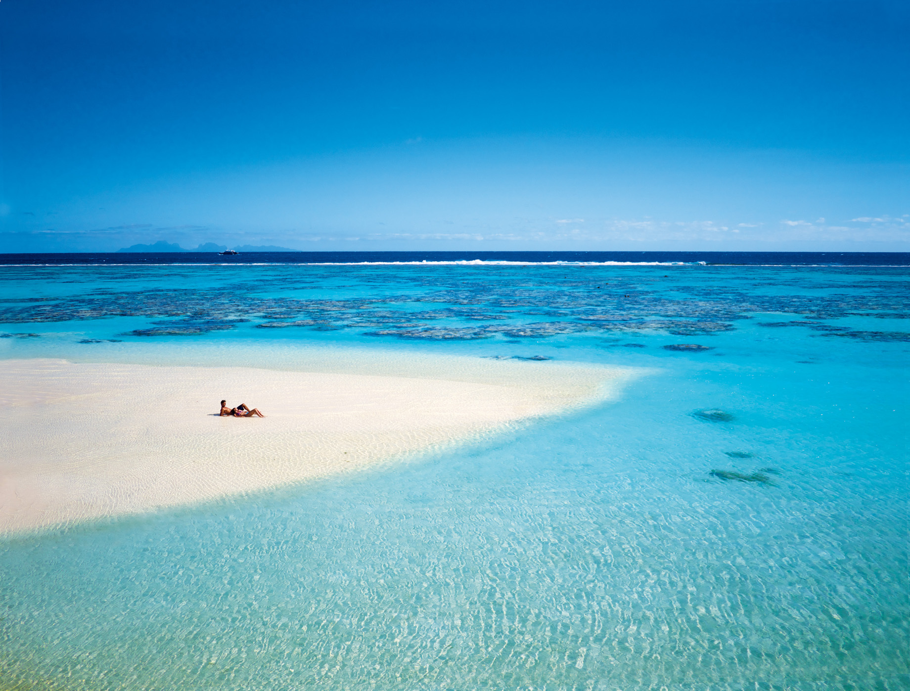 The Brando Resort – Tetiaroa Private Island, French Polynesia – Couple Lying on Beach
