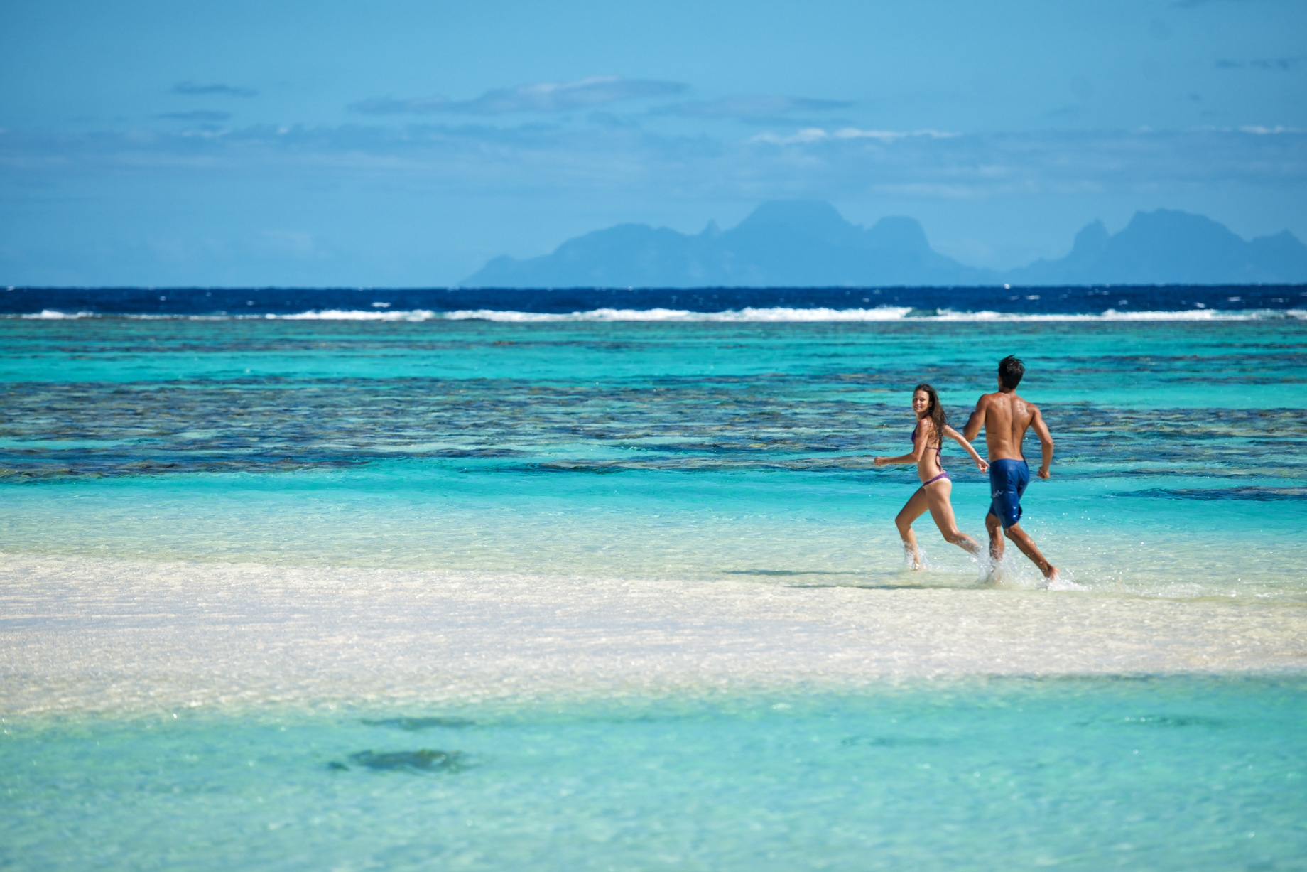 The Brando Resort - Tetiaroa Private Island, French Polynesia - Couple Running on Beach