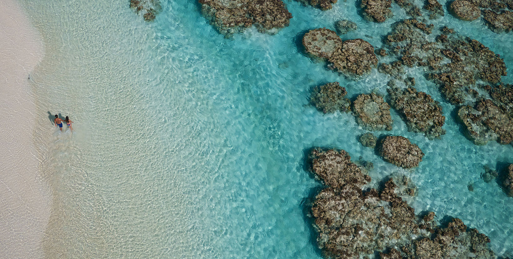 The Brando Resort – Tetiaroa Private Island, French Polynesia – Couple Walking on Beach