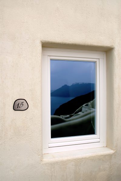 Mystique Hotel Santorini – Oia, Santorini Island, Greece - Room Exterior Window Ocean View Reflection