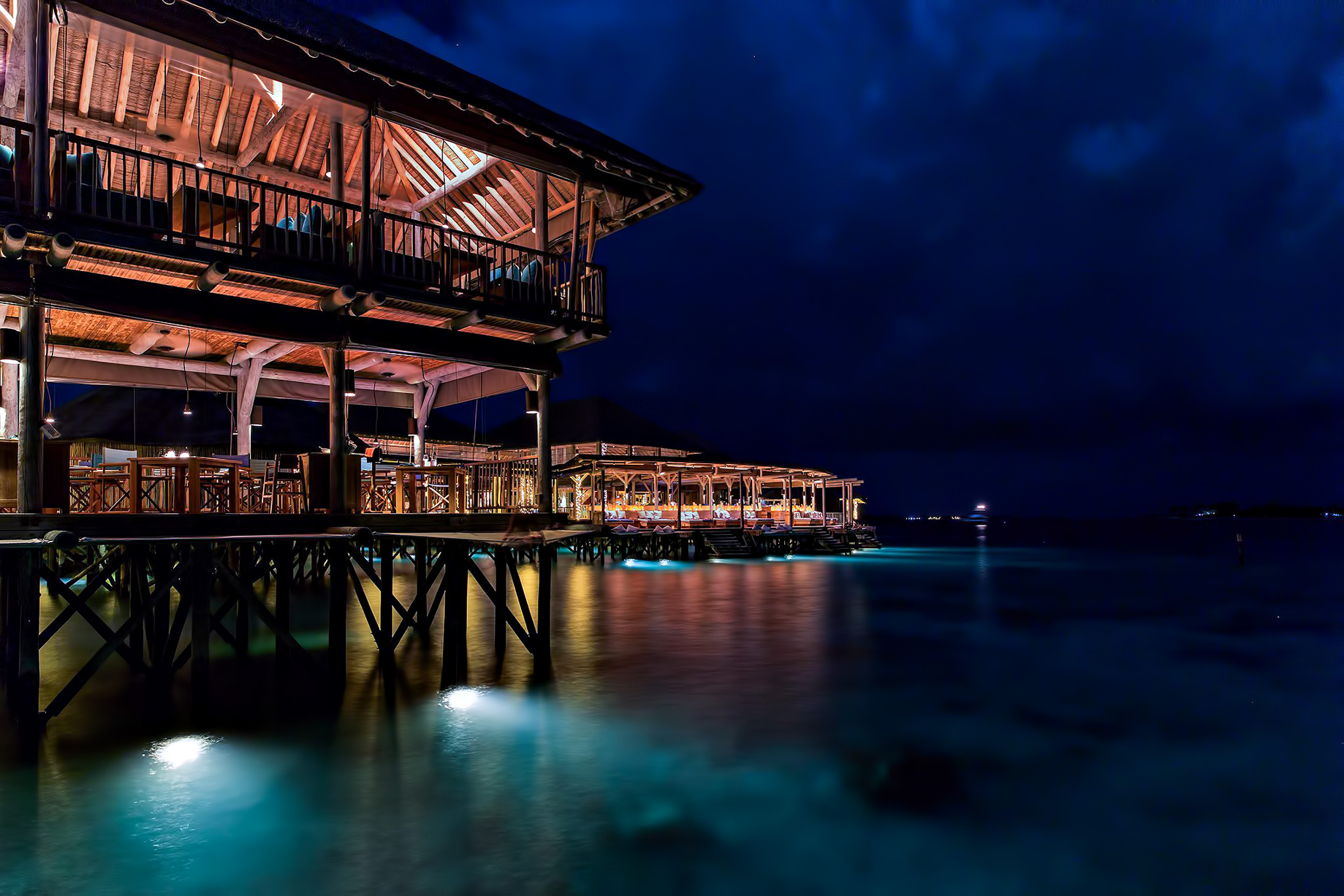 Six Senses Laamu Resort – Laamu Atoll, Maldives – Overwater Restaurant Night View