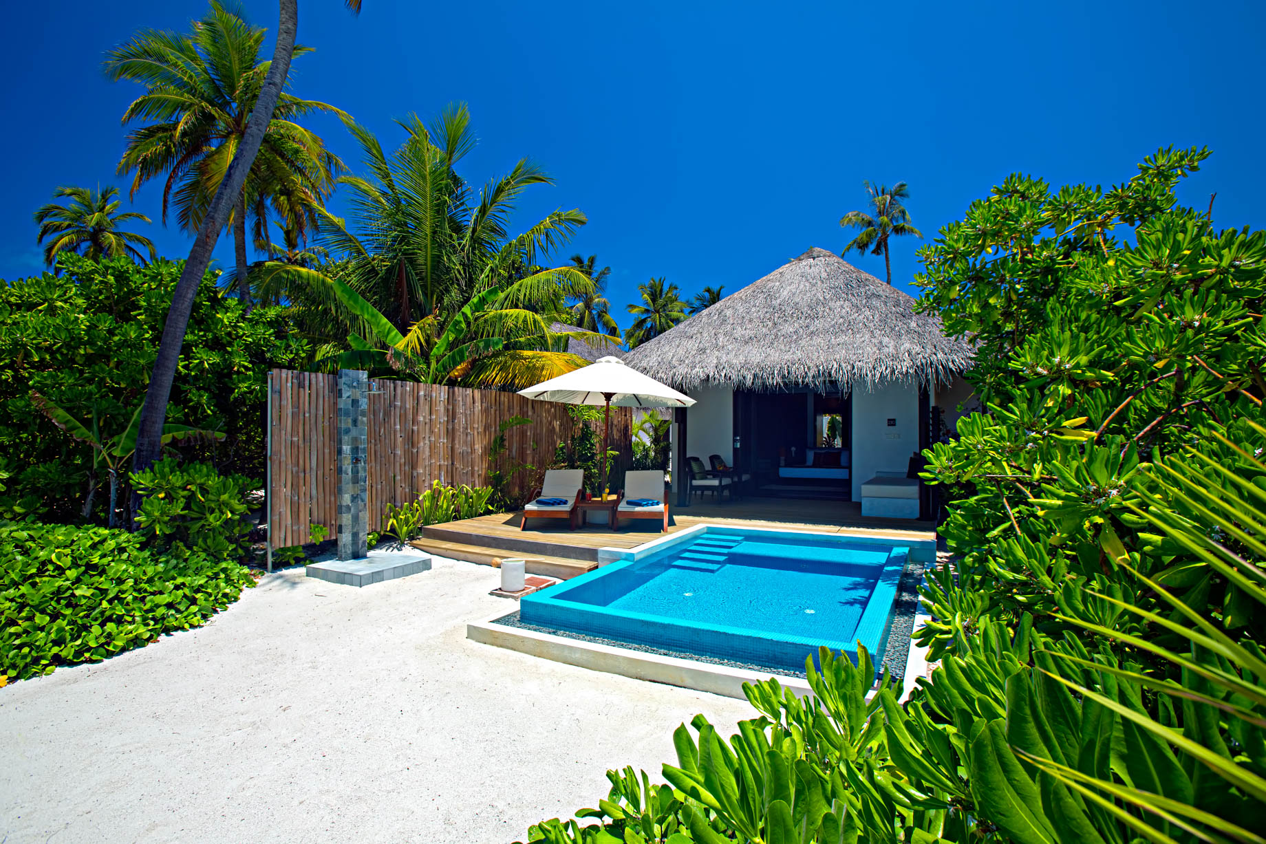 Velassaru Maldives Resort – South Male Atoll, Maldives – Beachfront Pool Chairs