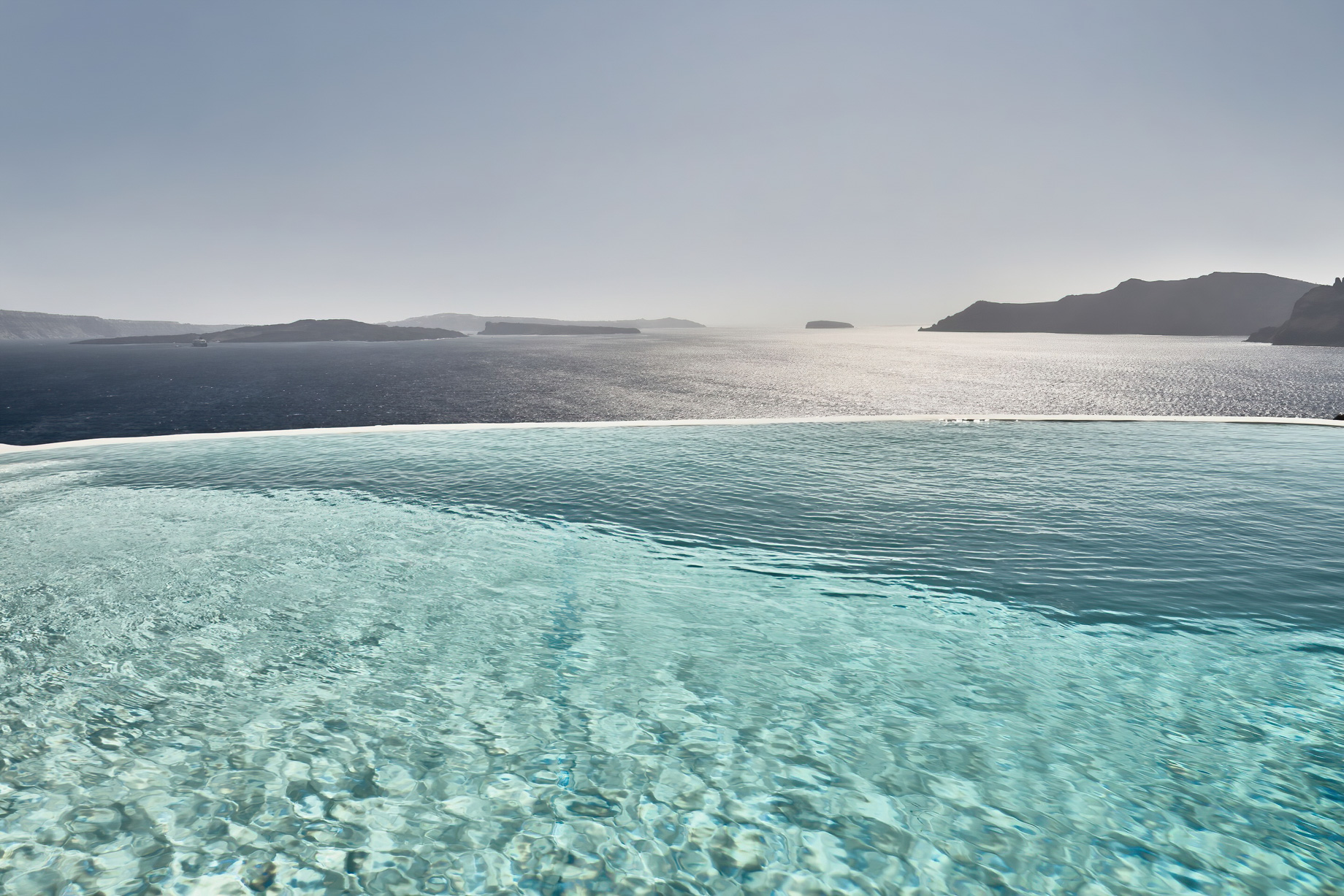 Mystique Hotel Santorini – Oia, Santorini Island, Greece - Clifftop Infinity Pool Ocean View