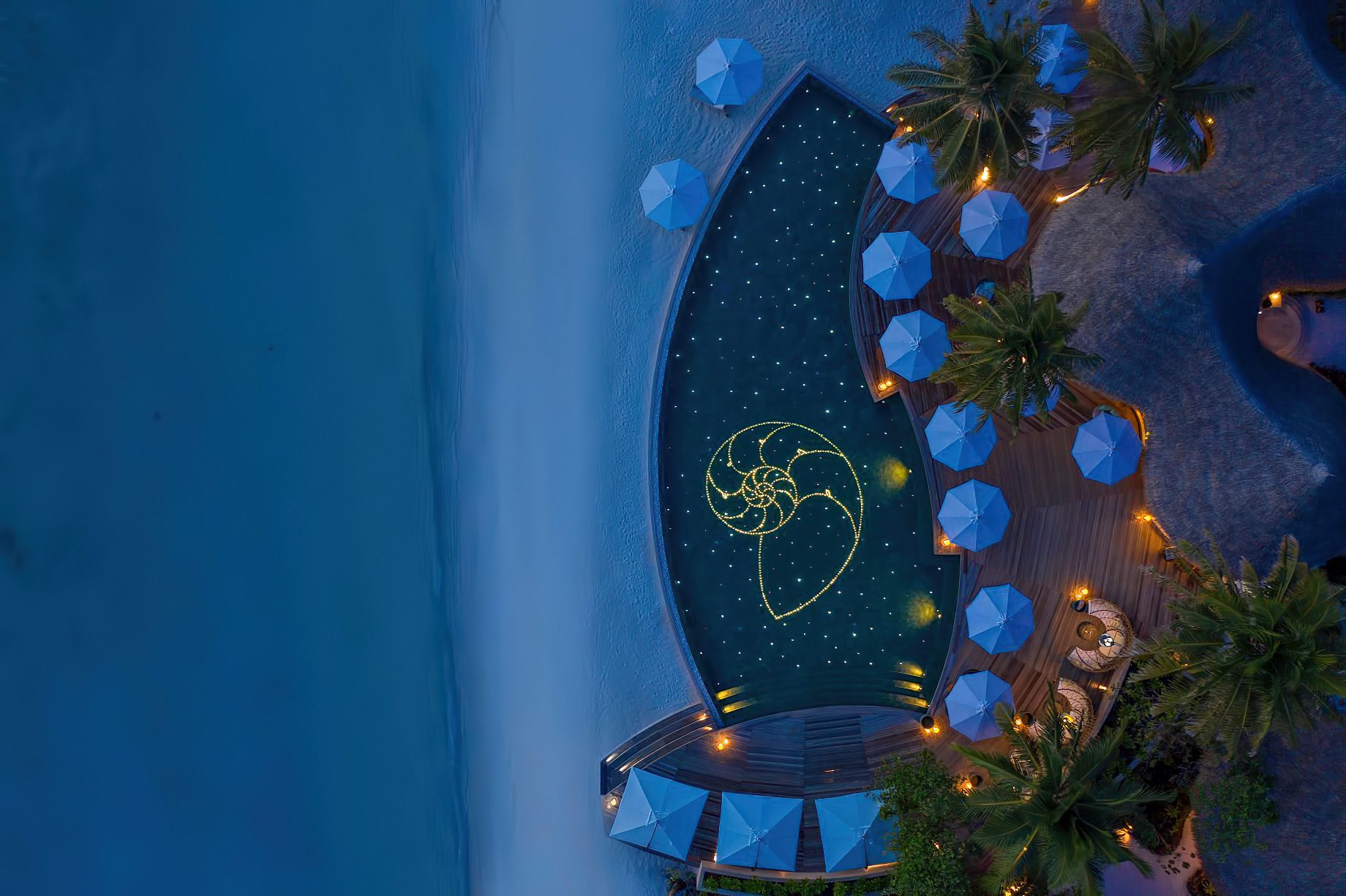 The Nautilus Maldives Resort - Thiladhoo Island, Maldives - Resort Pool Night Overhead View