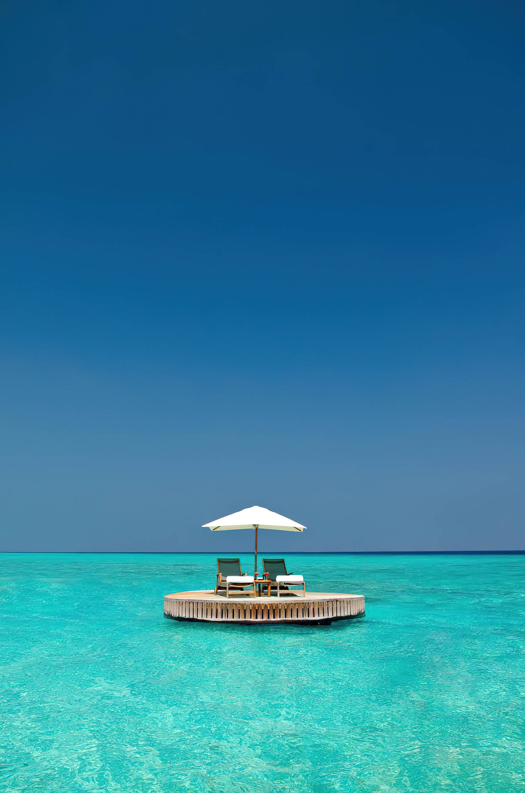 One&Only Reethi Rah Resort – North Male Atoll, Maldives – Ocean Water Lounge Chair Sun Umbrella