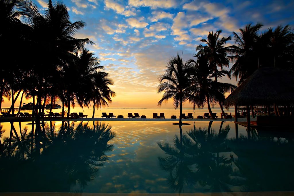 Gili Lankanfushi Resort - North Male Atoll, Maldives - Resort Beachfront Pool Sunset