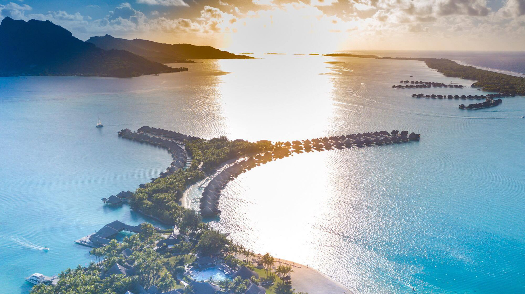 The St. Regis Bora Bora Resort – Bora Bora, French Polynesia – Resort Aerial Sunset