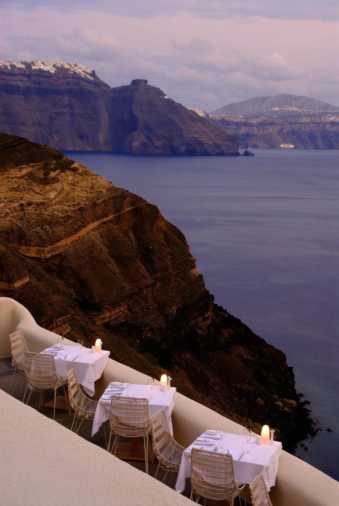 Mystique Hotel Santorini – Oia, Santorini Island, Greece - Cliffside Restaurant Tables Sea View