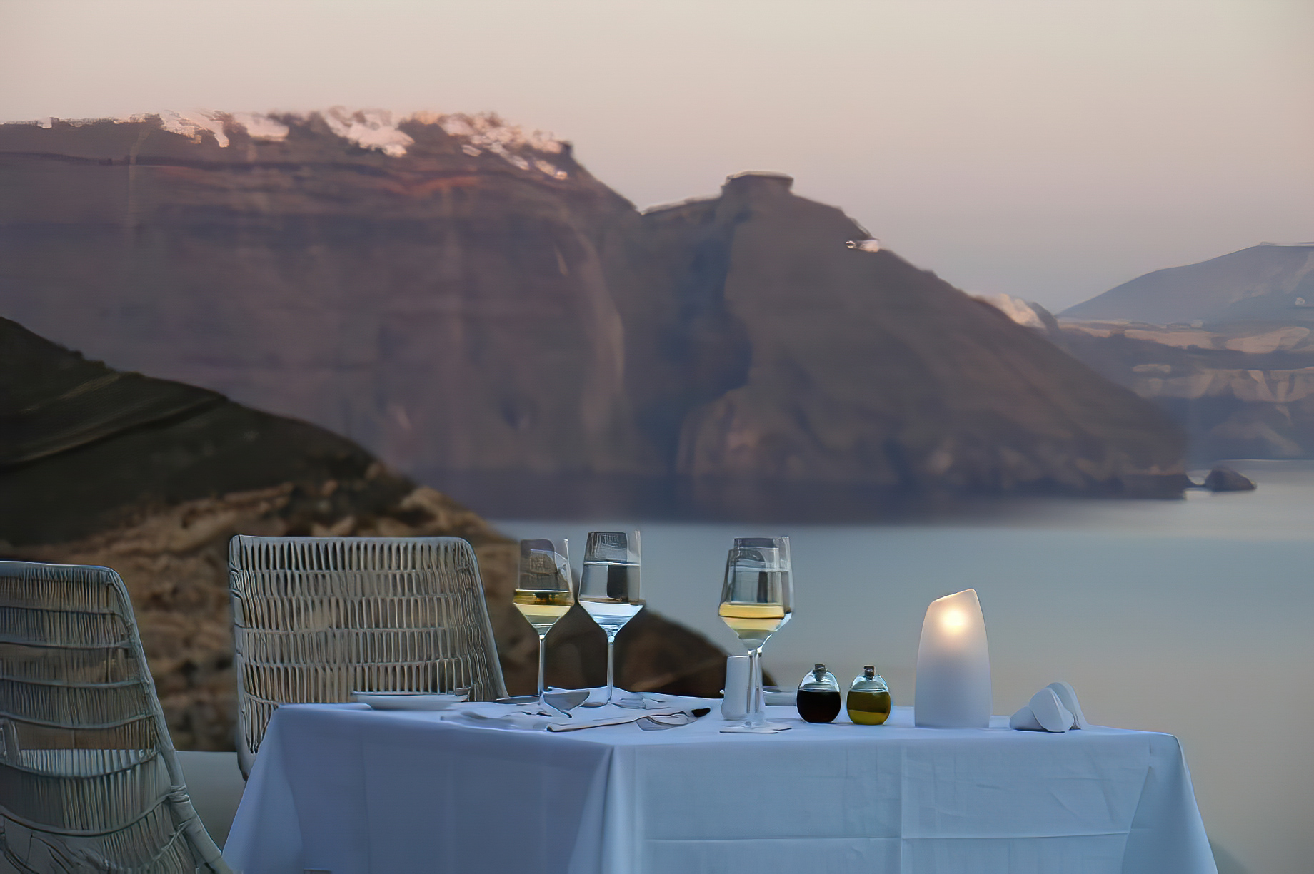 Mystique Hotel Santorini – Oia, Santorini Island, Greece – Cliffside Restaurant Table Sea View