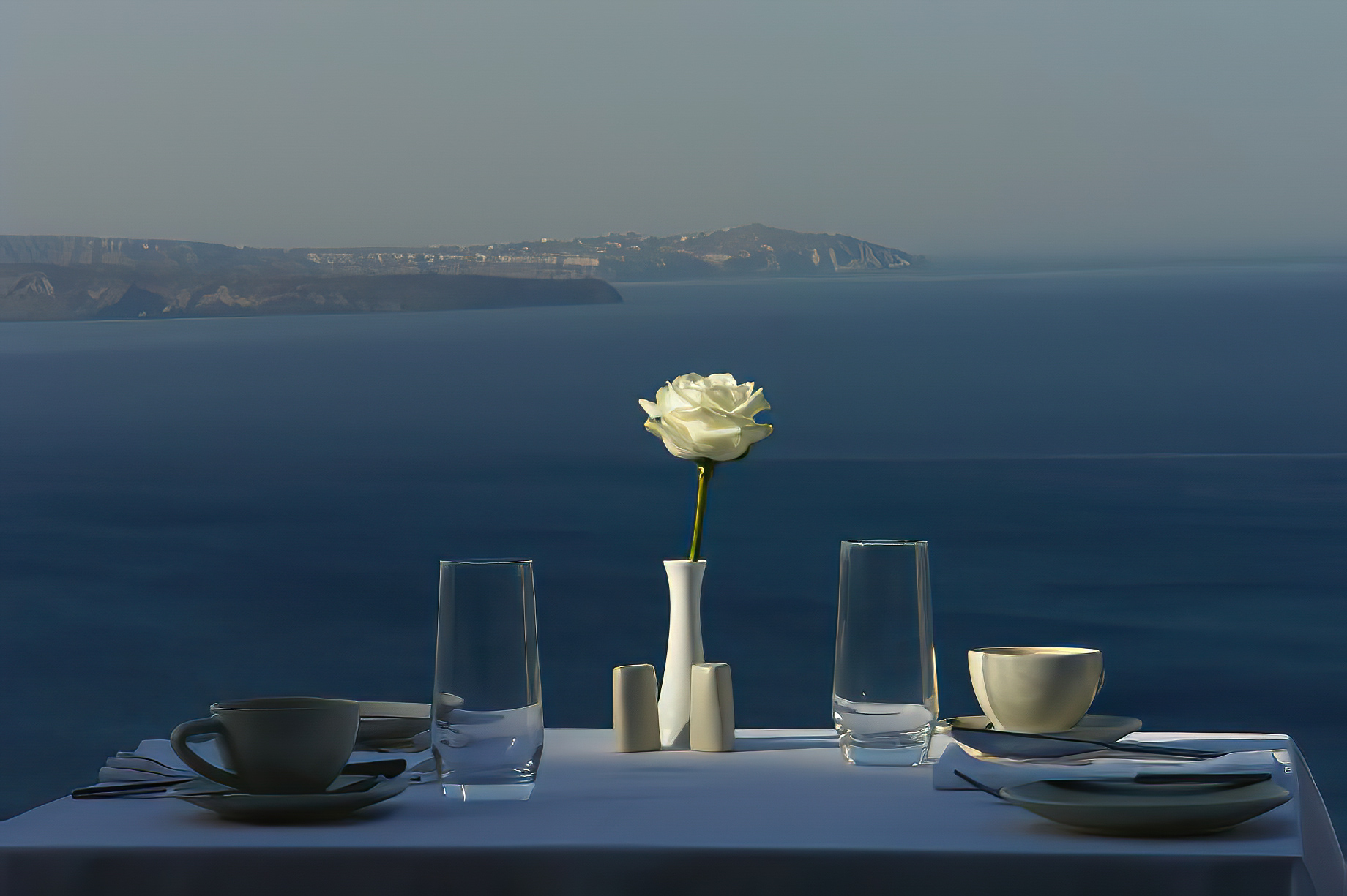 Mystique Hotel Santorini – Oia, Santorini Island, Greece - Cliffside Restaurant Table Ocean View