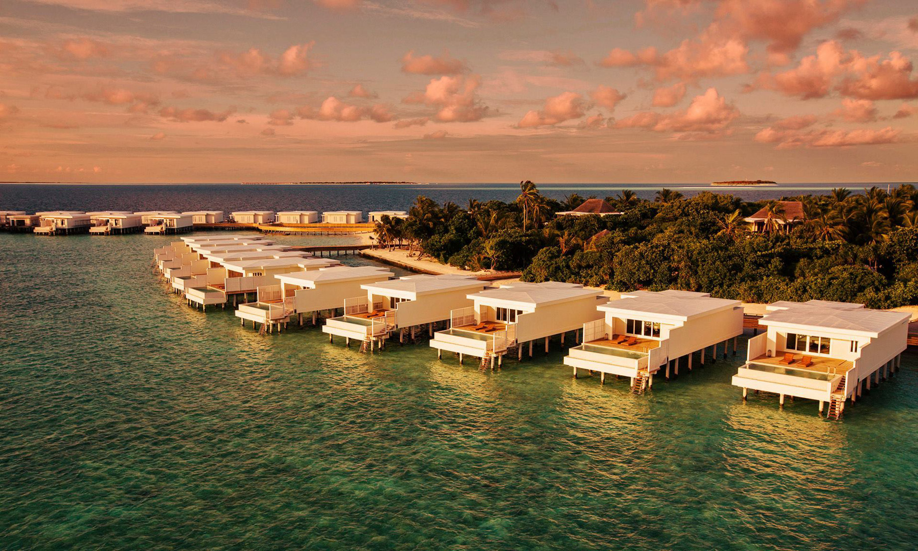 Amilla Fushi Resort and Residences – Baa Atoll, Maldives – Overwater Villas Sunset Aerial