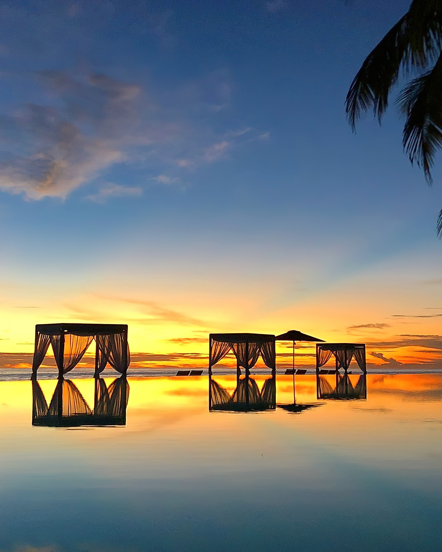 Amilla Fushi Resort and Residences – Baa Atoll, Maldives – Pool Reflections Sunset