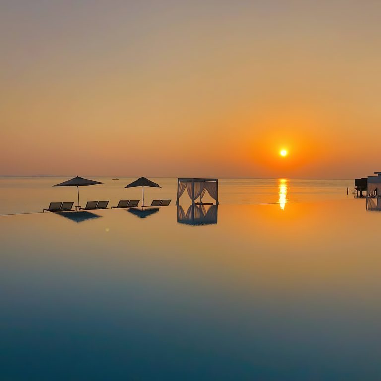 Amilla Fushi Resort and Residences – Baa Atoll, Maldives – Pool Reflections Sunset