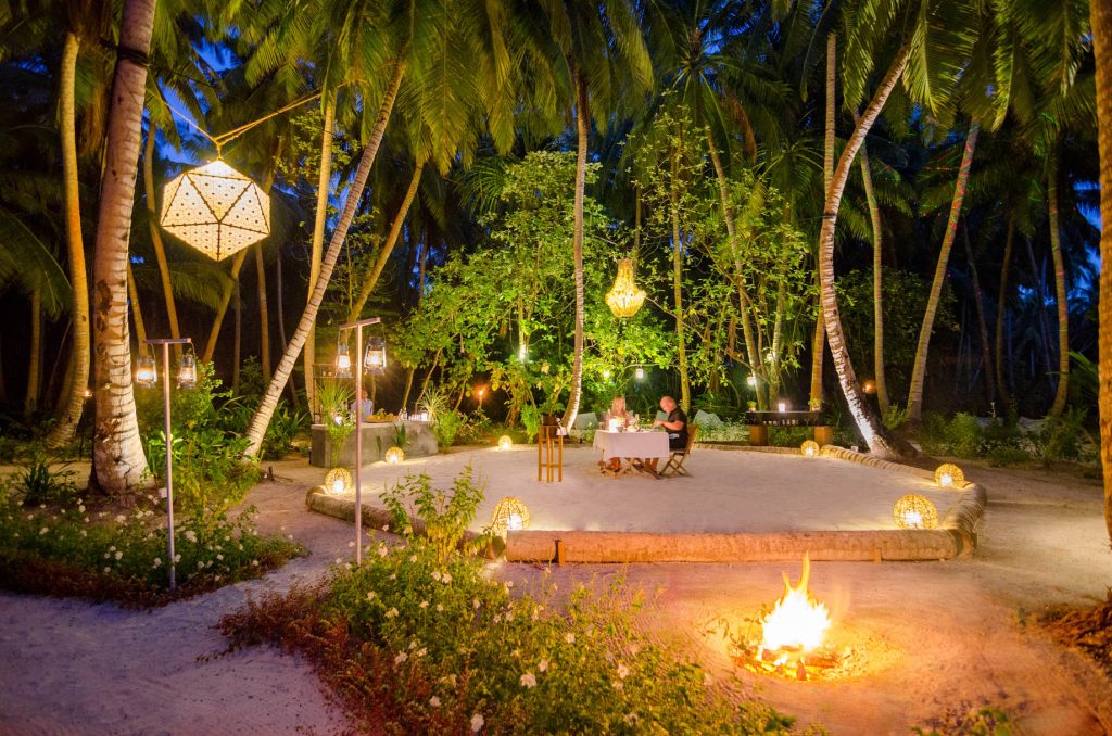 Amilla Fushi Resort and Residences - Baa Atoll, Maldives - Palm Tree Courtyard Dining Night
