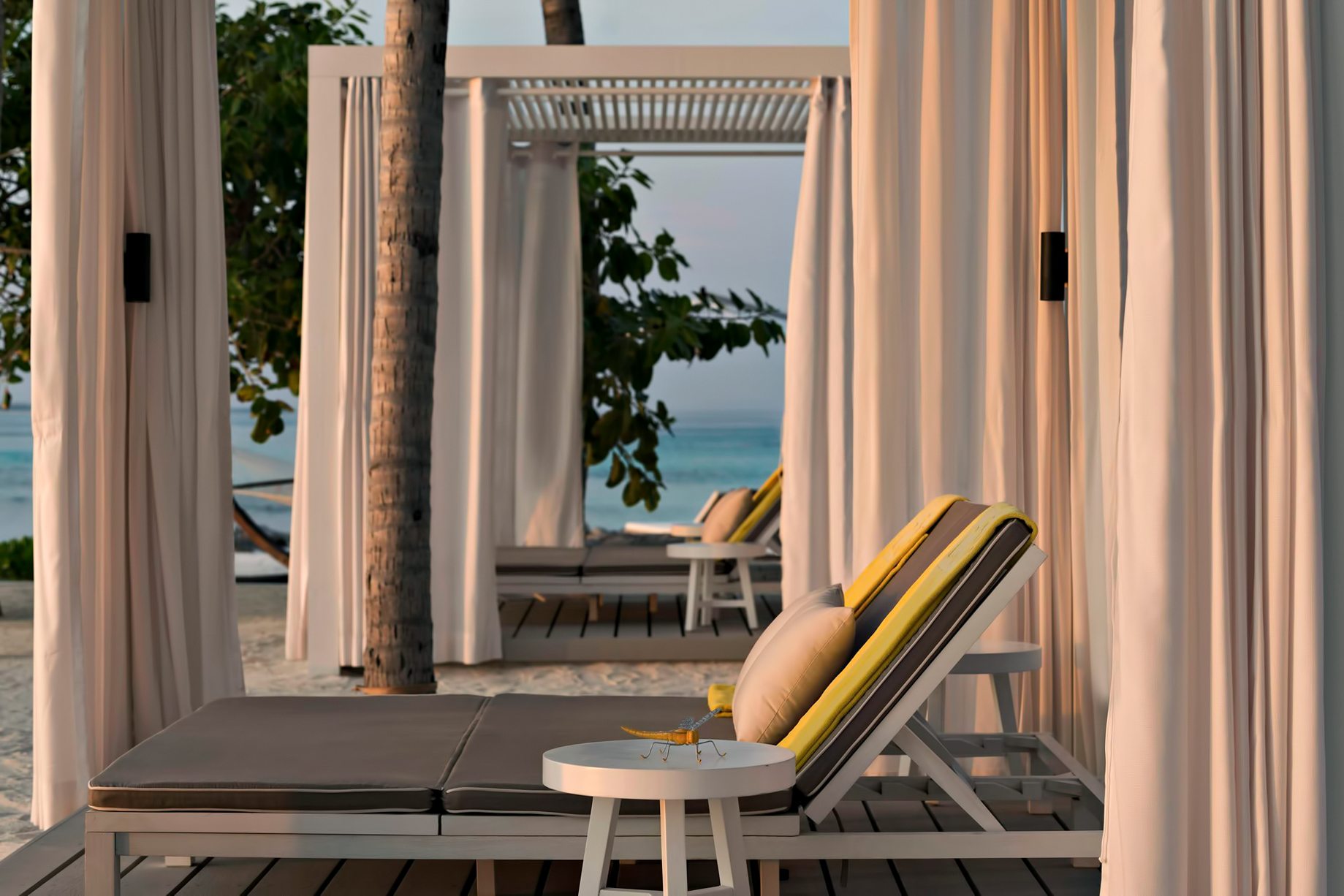 Cheval Blanc Randheli Resort – Noonu Atoll, Maldives – Beach Club Lounge Chairs Sunset