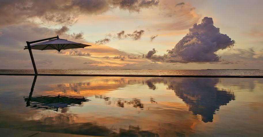 Cheval Blanc Randheli Resort - Noonu Atoll, Maldives - Beachfront Infinity Pool Sunset