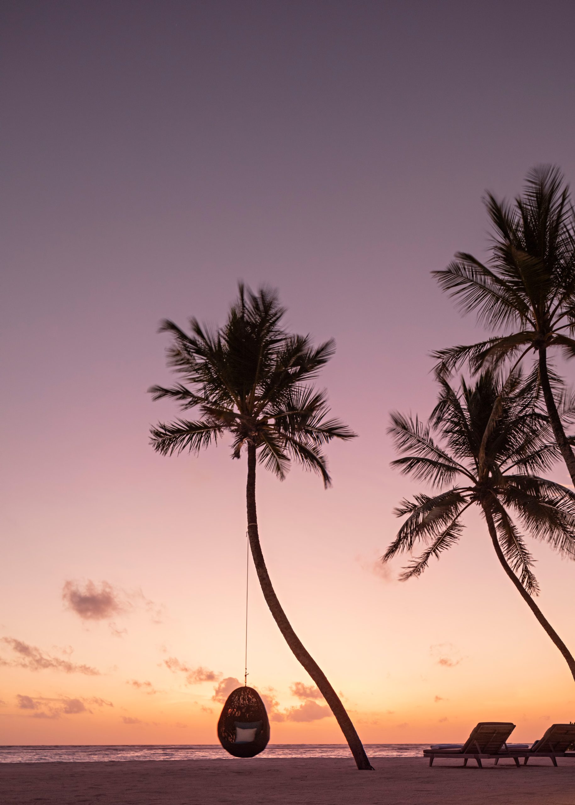 One&Only Reethi Rah Resort – North Male Atoll, Maldives – Beach Palm Tree Hanging Chair Sunset