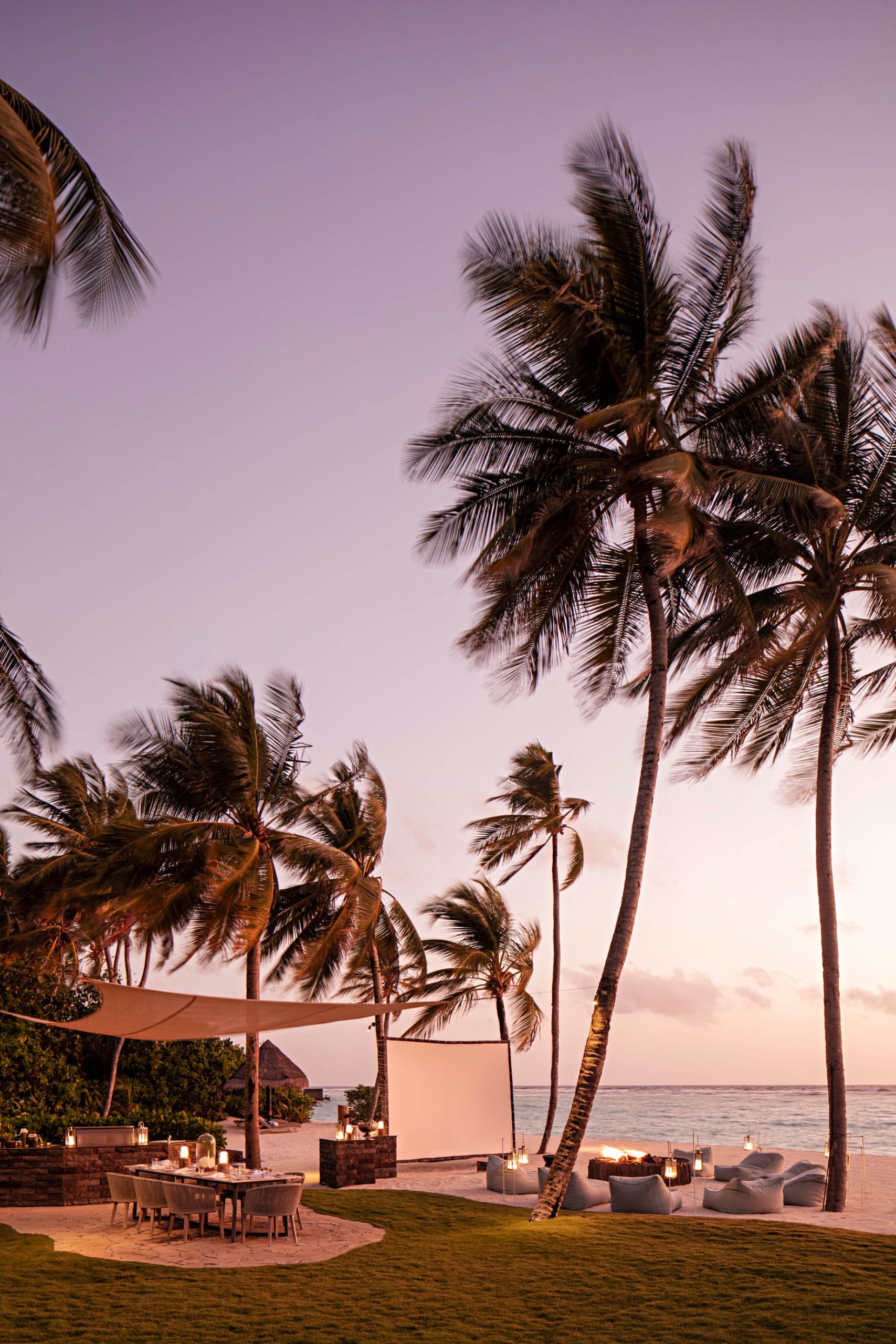 One&Only Reethi Rah Resort – North Male Atoll, Maldives – Beachfront Lounge Chairs Sunset