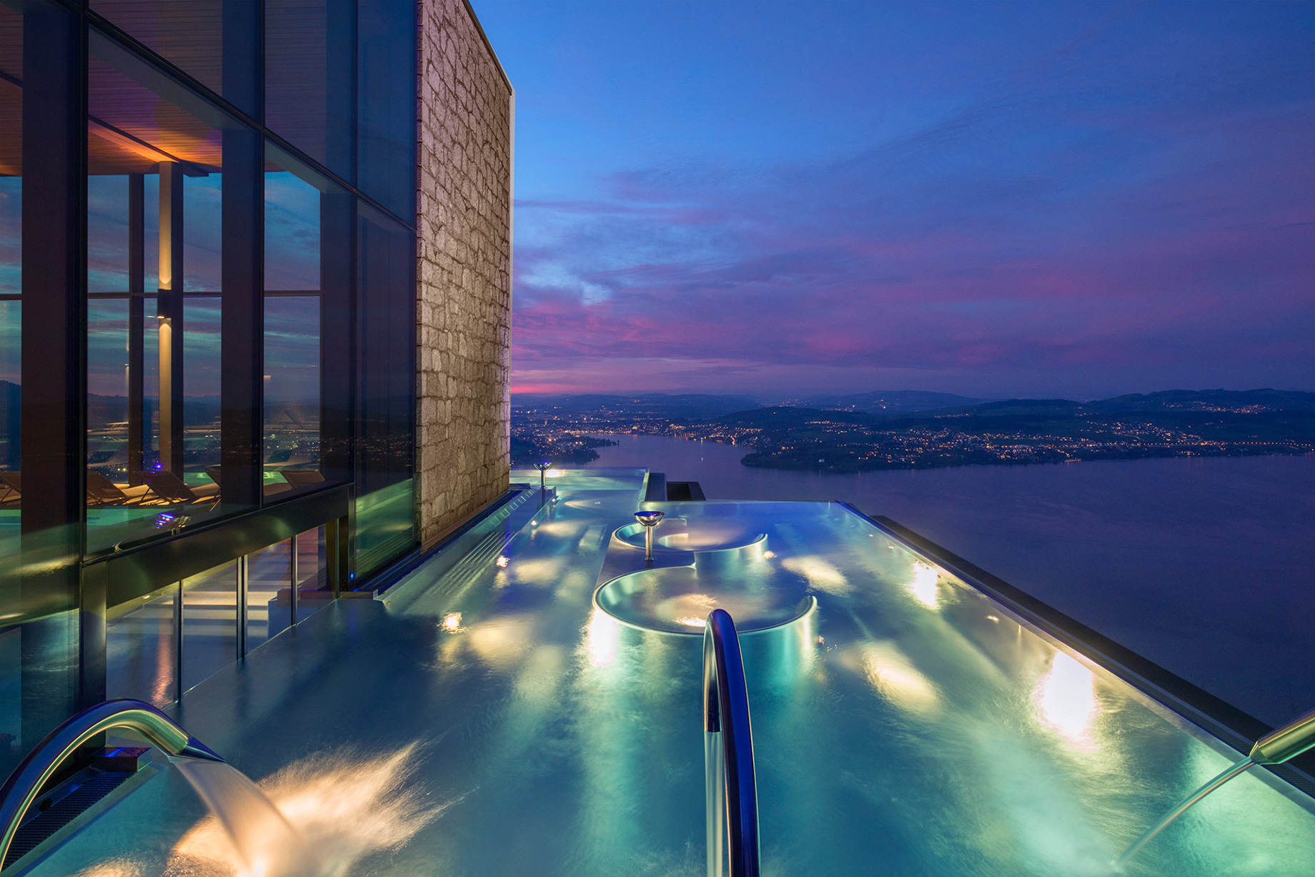 Burgenstock Hotel & Alpine Spa – Obburgen, Switzerland – Alpine Spa Outdoor Infinity Edge Pool Sunset Lake View