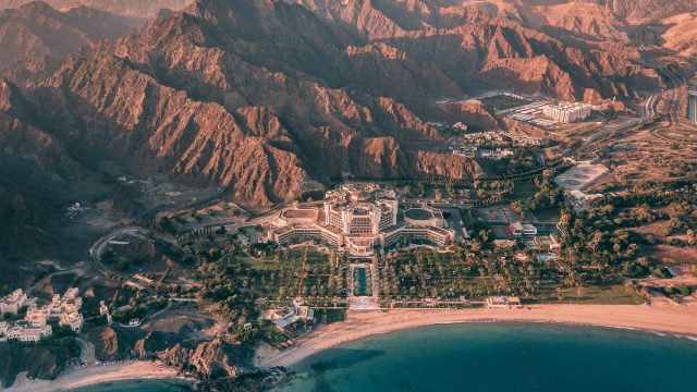 Al Bustan Palace, A Ritz-Carlton Hotel - Muscat, Oman - Hotel Exterior Aerial View