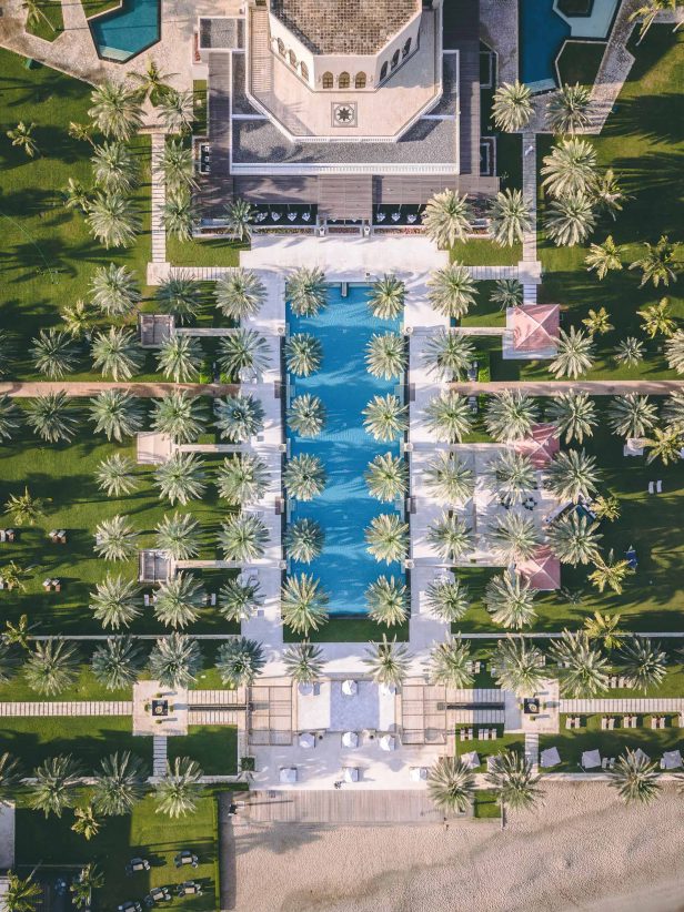 Al Bustan Palace, A Ritz-Carlton Hotel - Muscat, Oman - Infinity Pool Overhead Aerial View
