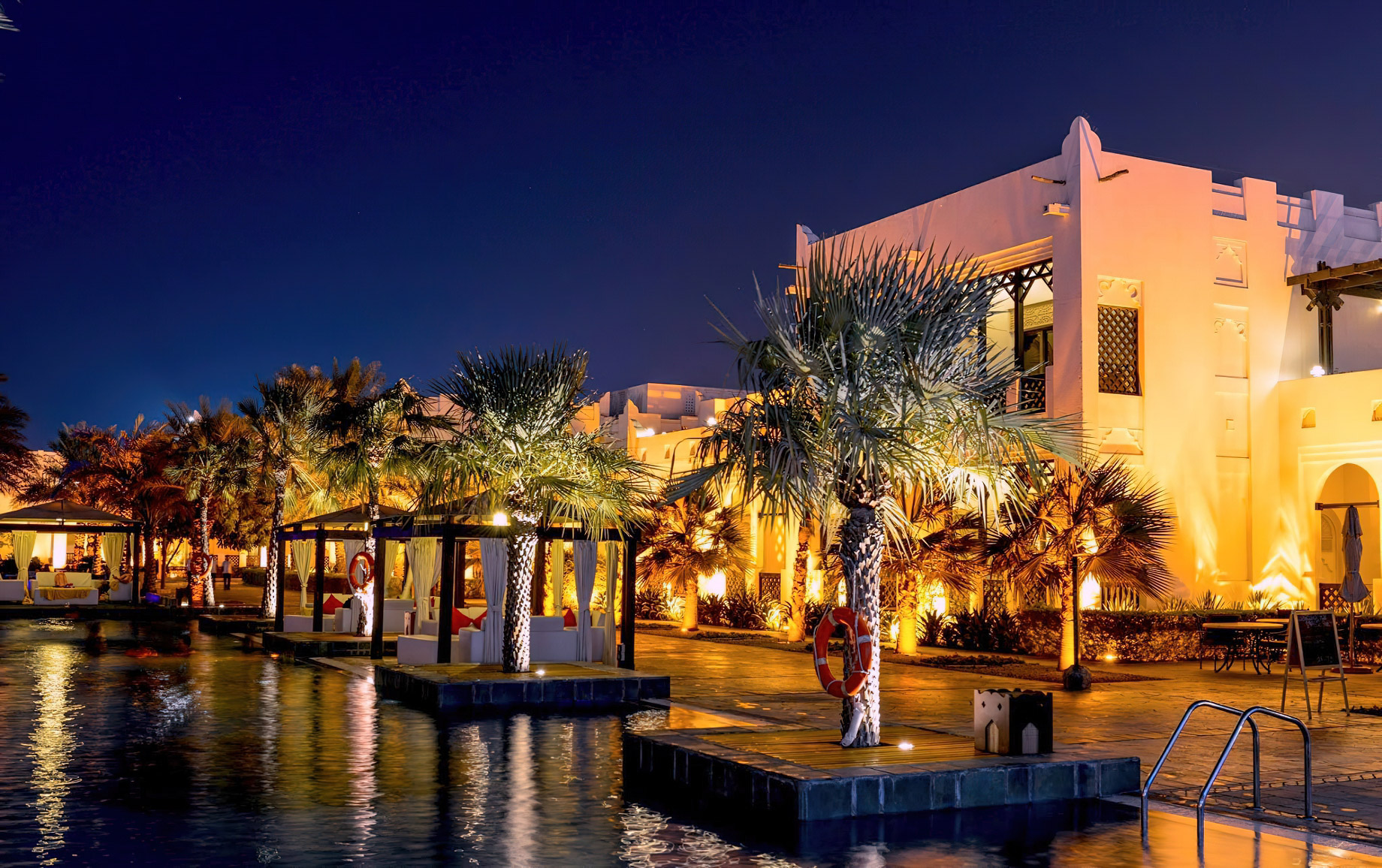 Sharq Village & Spa, A Ritz-Carlton Hotel - Doha, Qatar - Pool Deck Night View