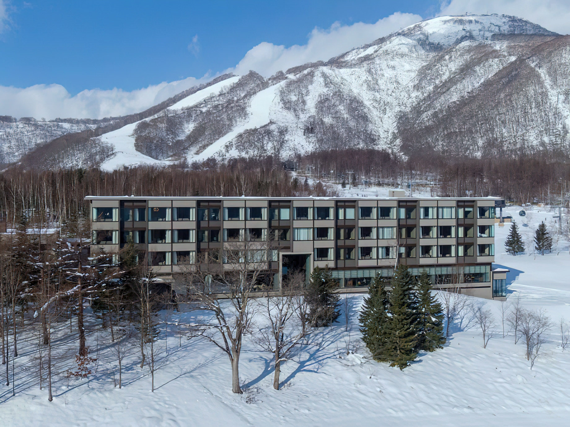 Higashiyama Niseko Village, A Ritz-Carlton Reserve Hotel - Hokkaido, Japan - Winter Exterior Aerial