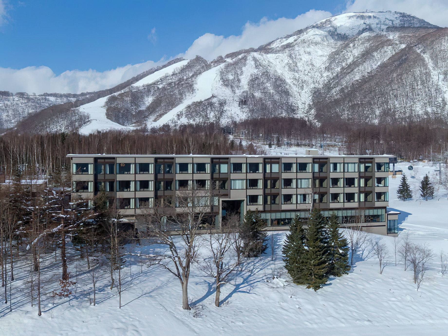 Higashiyama Niseko Village, A Ritz-Carlton Reserve Hotel – Hokkaido, Japan – Winter Exterior Aerial