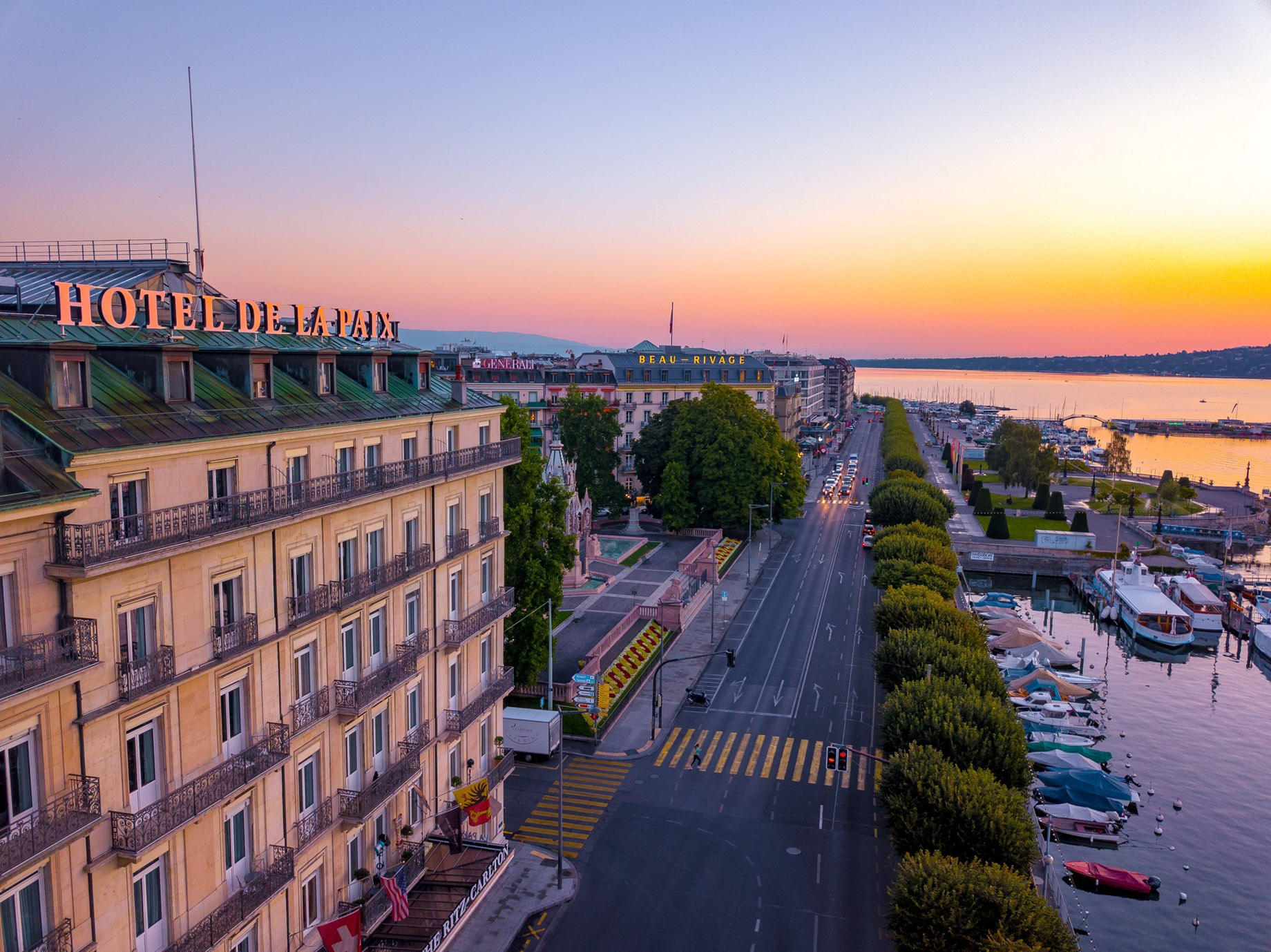 The Ritz-Carlton Hotel de la Paix, Geneva – Geneva, Switzerland – Hotel Exterior Lakefront Aerial Sunset