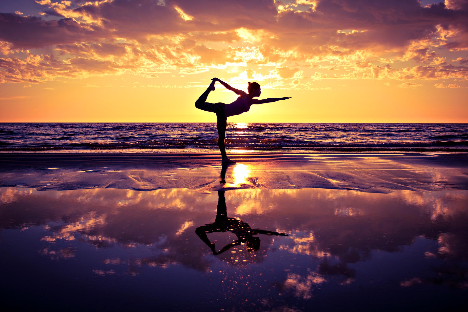 Meditative Yoga - Woman Exercising On The Beach At Sunset