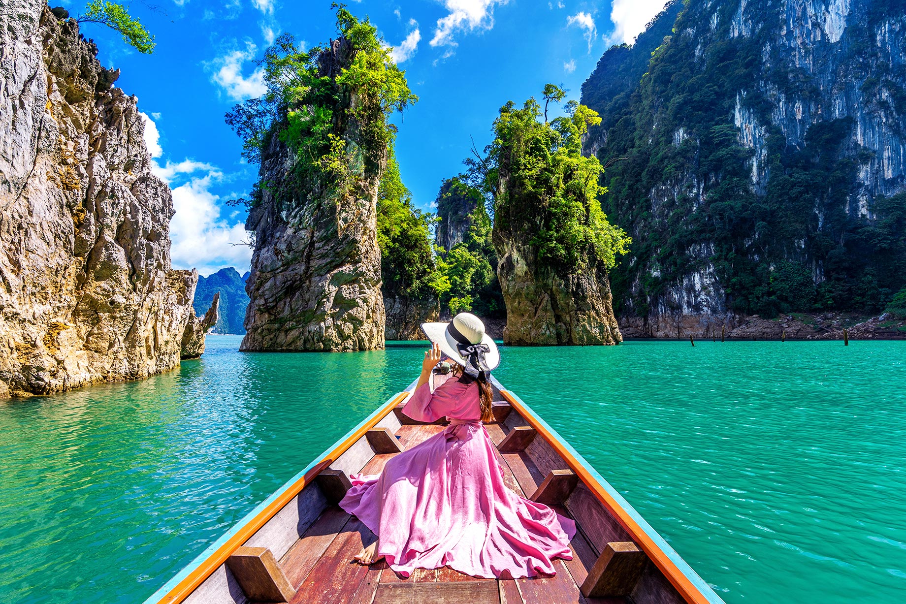 Woman In Pink Dress And White Hat On A Boat - Ratchaprapha Dam - Khao Sok National Park, Surat Thani Province, Thailand