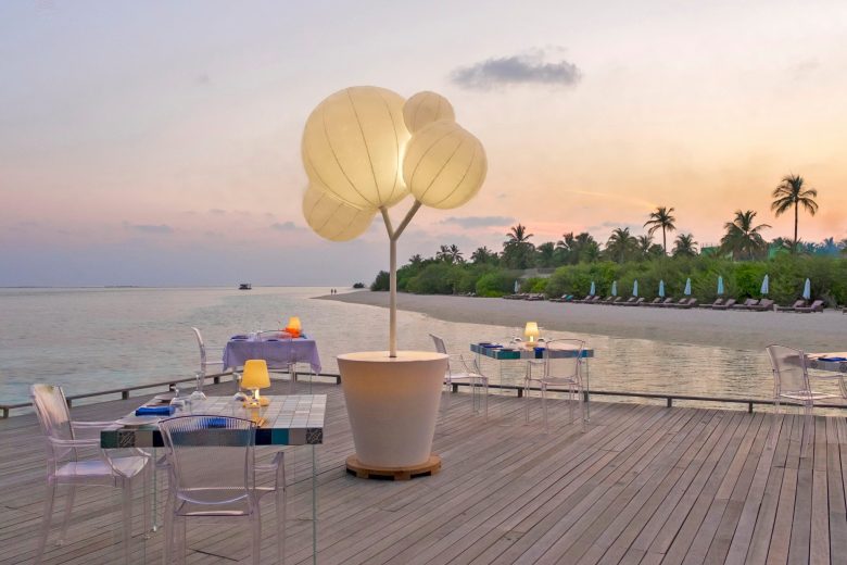 Cocoon Maldives Resort - Ookolhufinolhu, Lhaviyani Atoll, Maldives - Manta Overwater Restaurant Dining Tables Sunset
