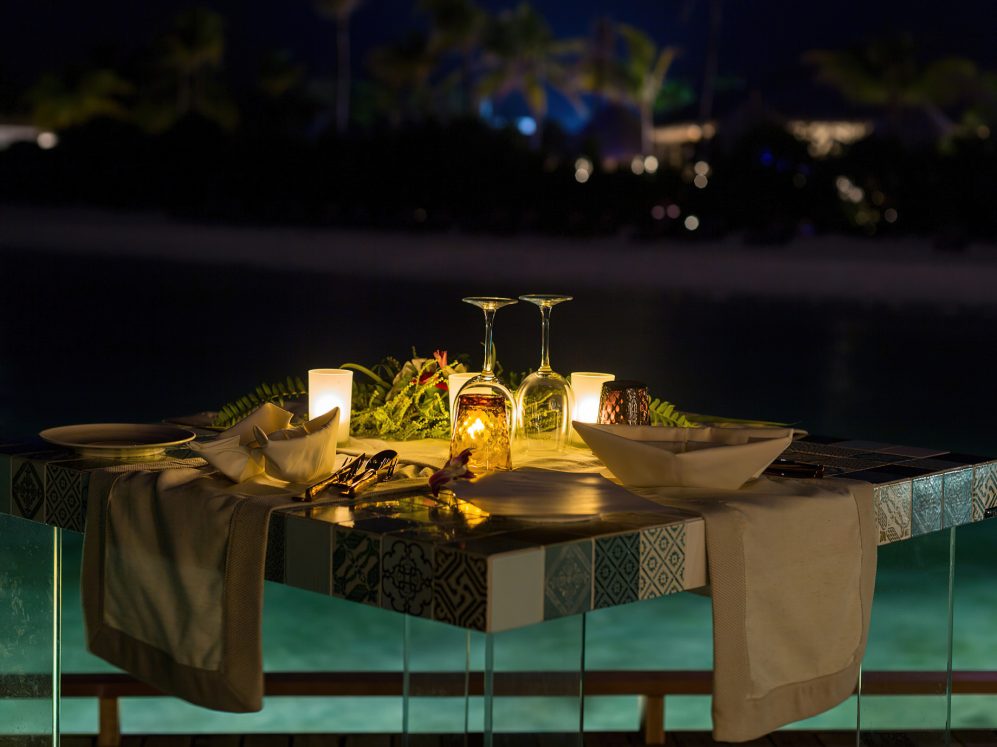 Cocoon Maldives Resort - Ookolhufinolhu, Lhaviyani Atoll, Maldives - Manta Overwater Restaurant Dining Table Night