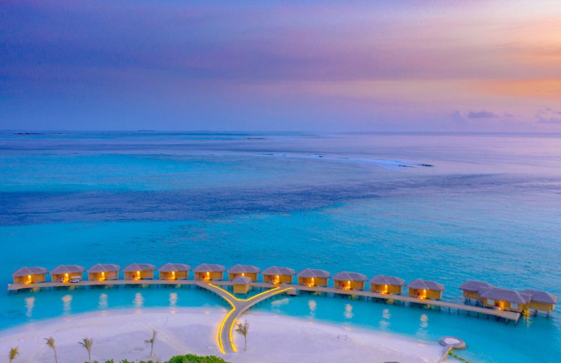 You & Me Maldives Resort - Uthurumaafaru, Raa Atoll, Maldives - Overwater Villa Aerial View Sunset