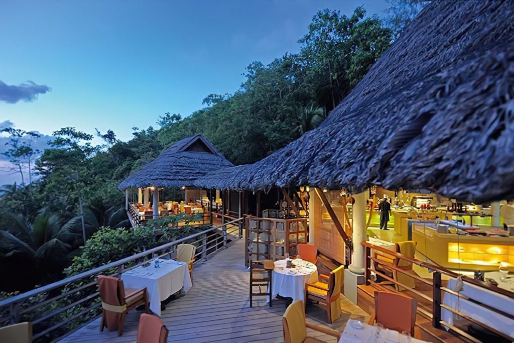 Constance Lemuria Resort - Praslin, Seychelles - Legend Restaurant Exterior Night Dining