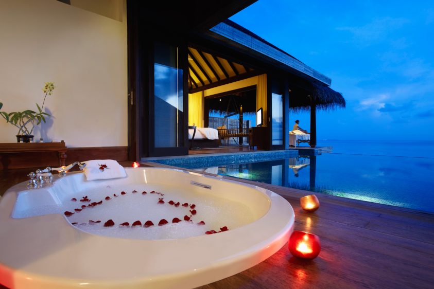 Anantara Kihavah Maldives Villas Resort - Baa Atoll, Maldives - Over Water Pool Villa Bathroom Ocean View Evening