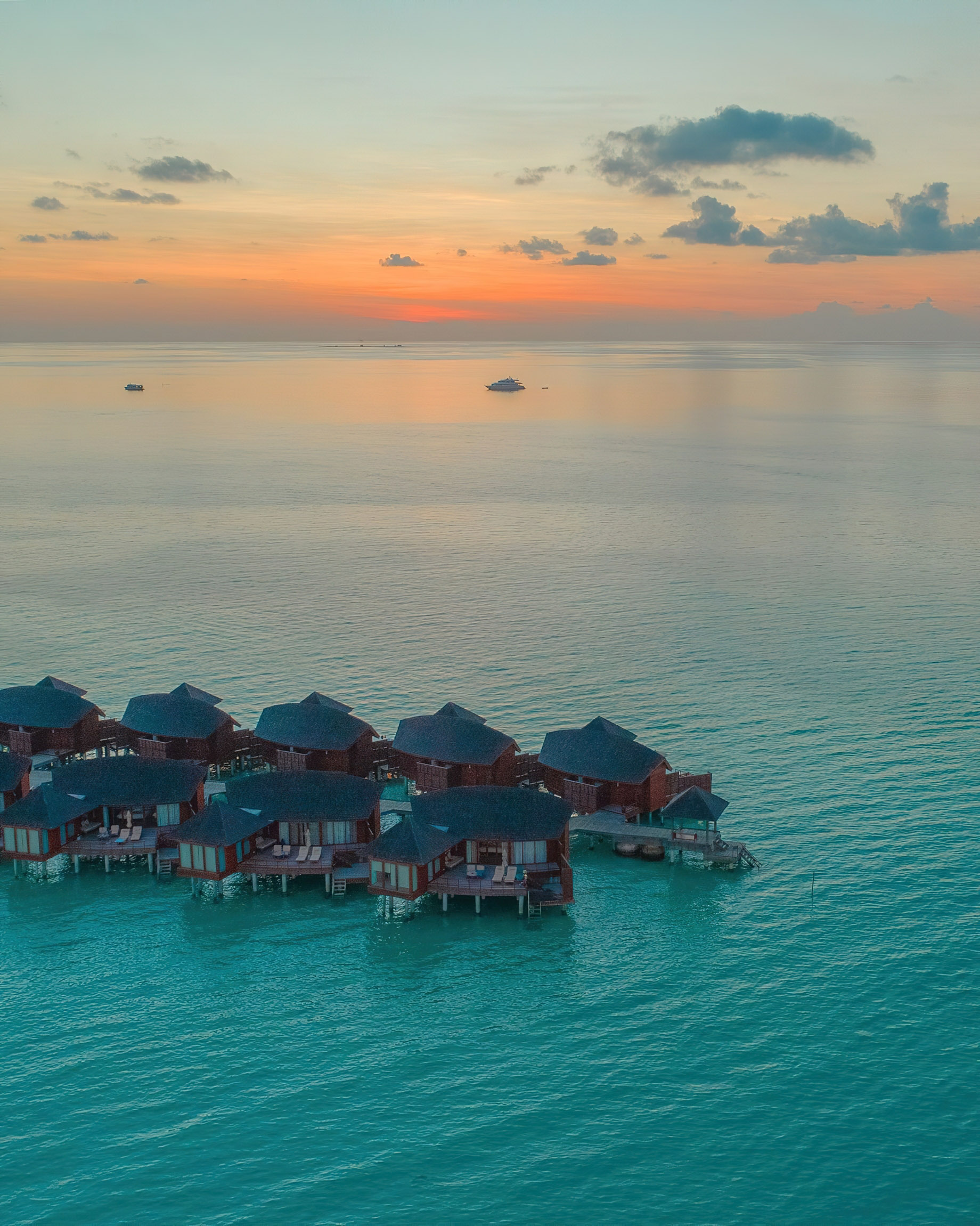 Anantara Thigu Maldives Resort – South Male Atoll, Maldives – Overwater Villas Aerial View Sunset