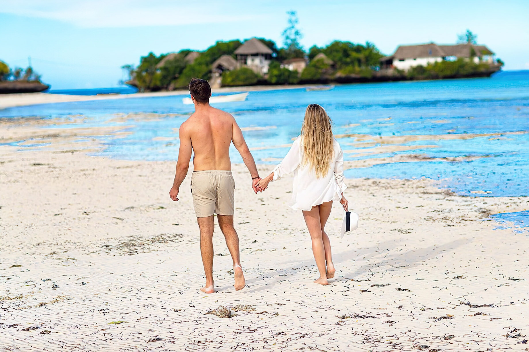 The Island Pongwe Lodge - Pongwe, Zanzibar, Tanzania - Couple Walking at Low Tide