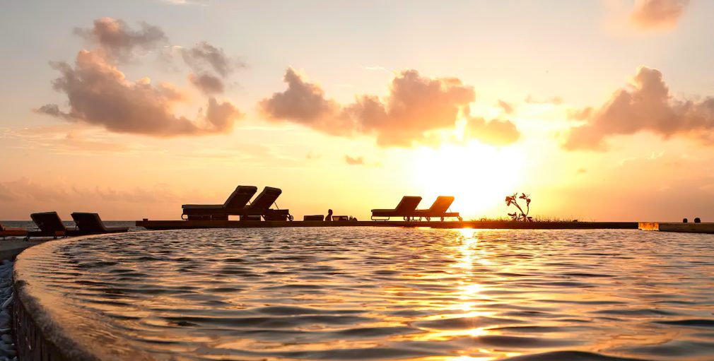 Constance Moofushi Resort - South Ari Atoll, Maldives - Pool Sunset