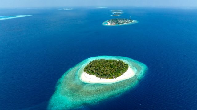 Aerial view of a Tropical island in Baa atoll, Maldives