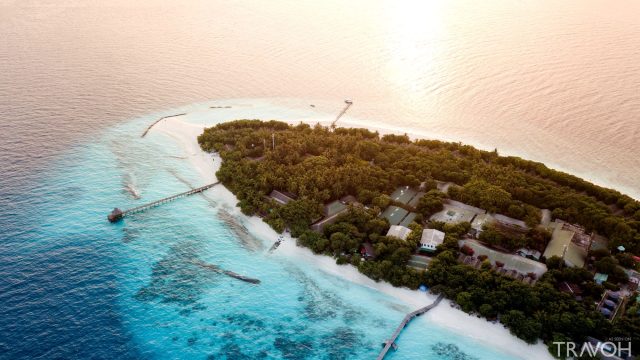 Drone shot of a beach and small island in the Baa Atoll in the Maldives