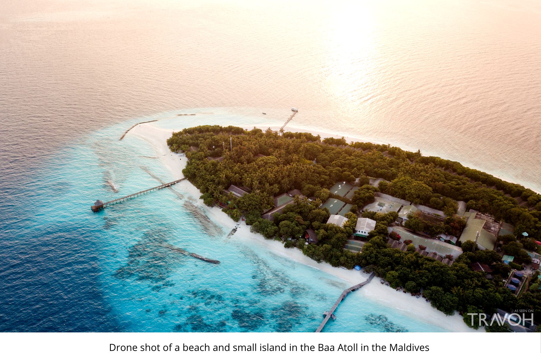 Drone shot of a beach and small island in the Baa Atoll in the Maldives