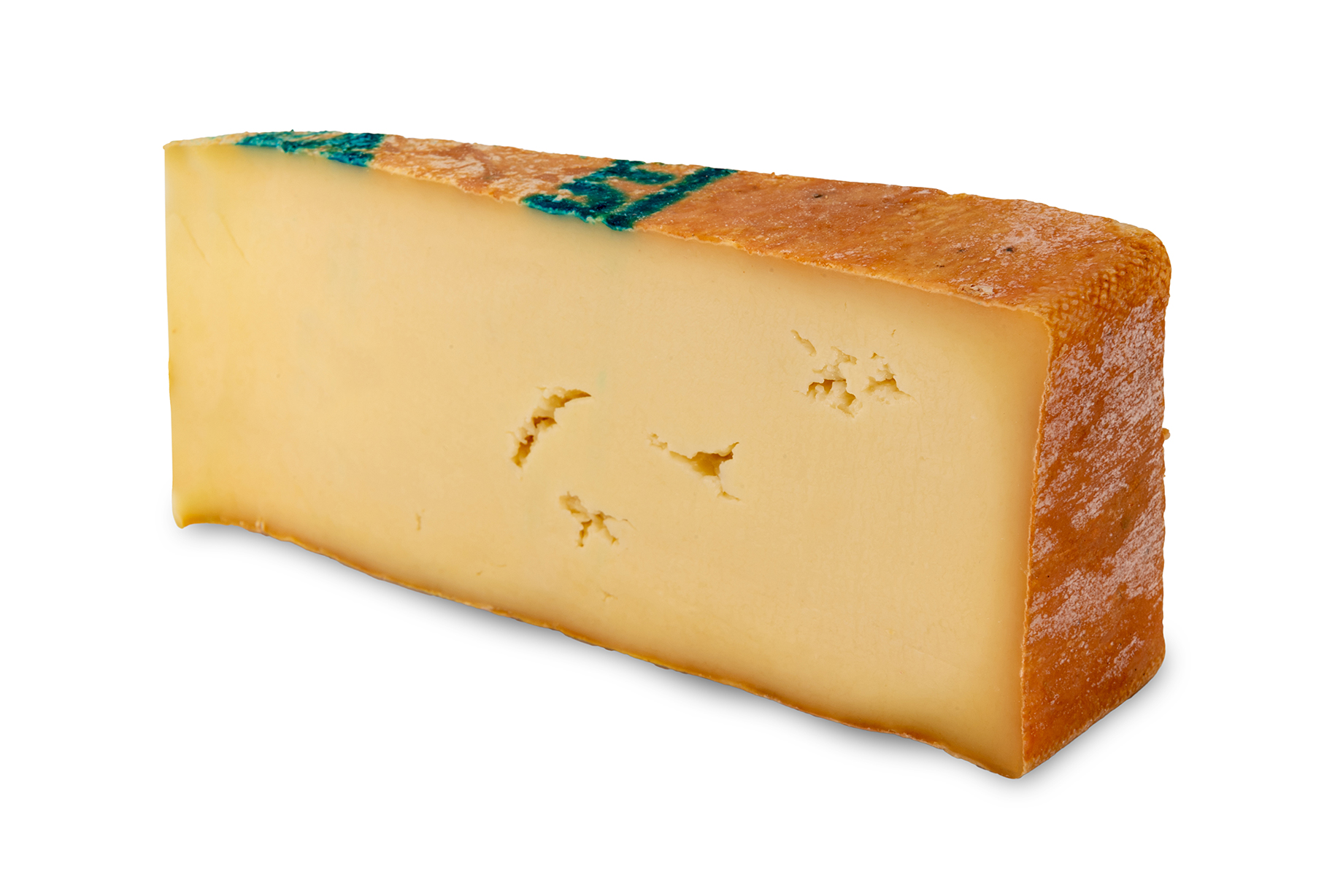 Fontina cheese From Aosta Valle, Italy, Made With Milk From Cows Grazing In The Mountains Pasture