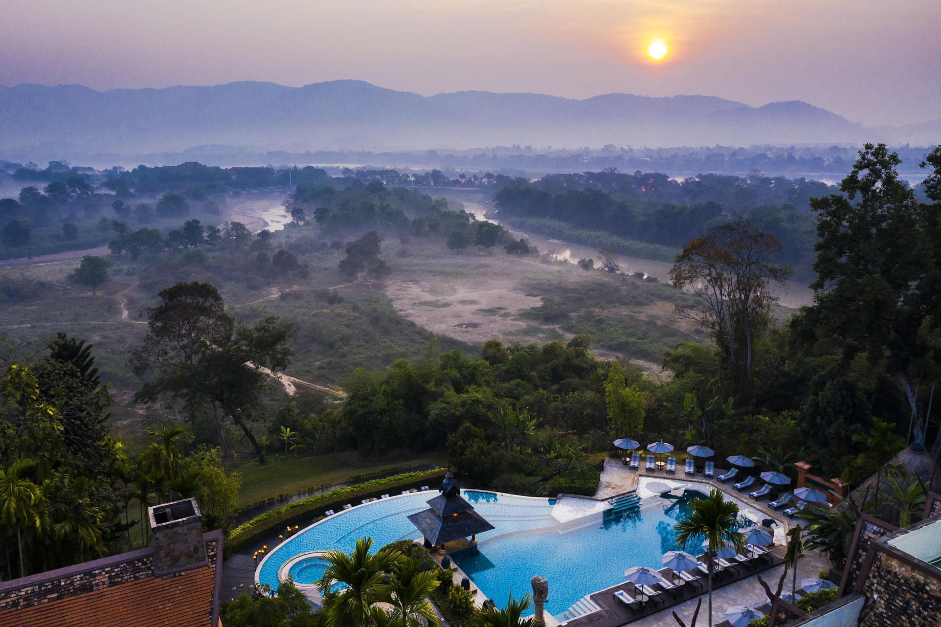 Anantara Golden Triangle Elephant Camp & Resort – Chiang Rai, Thailand – Pool Sunset Aerial View