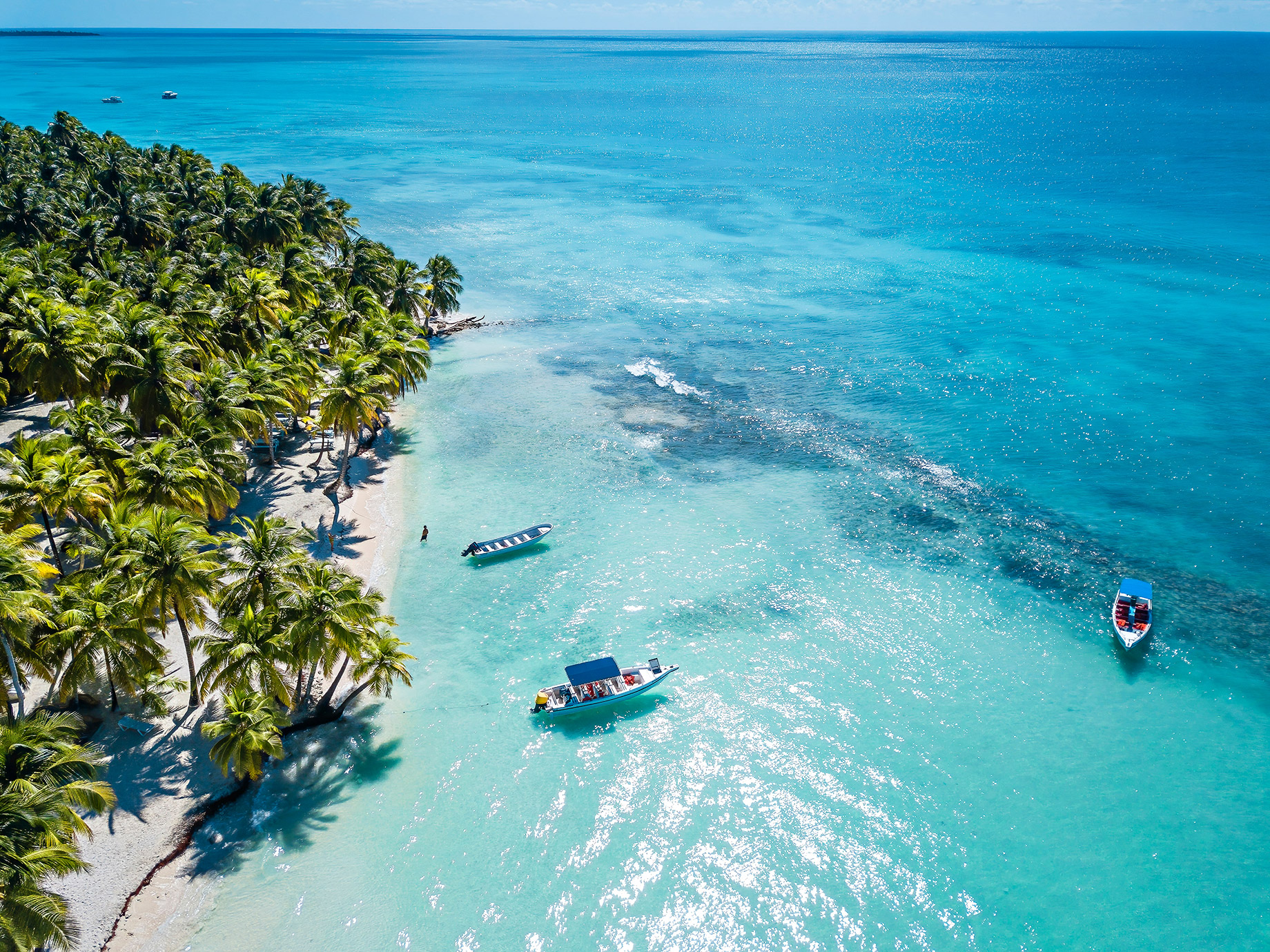 Aerial View over the Caribbean Sea with Clear Blue Water and Green Palms on Saona Island in Dominican Republic