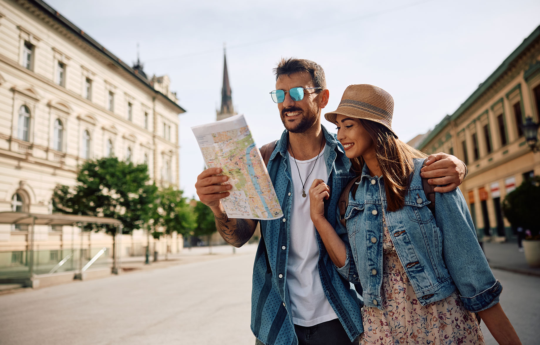 Couple Walking Through a European City with a Map